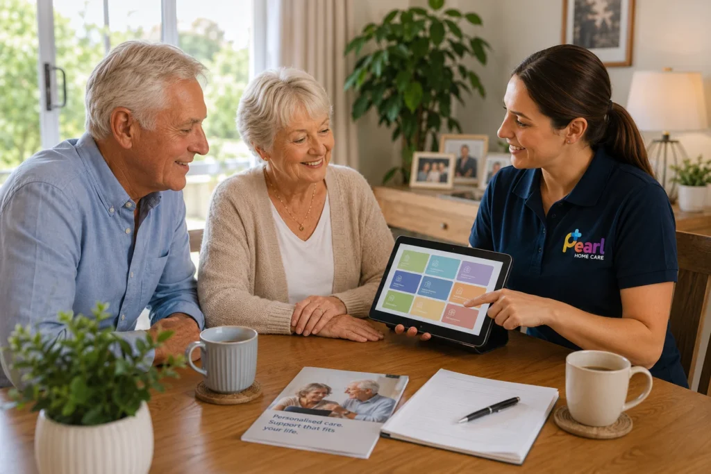 Home Care Packages consultation with a Pearl Home Care coordinator explaining personalised home care services to an older Australian couple
